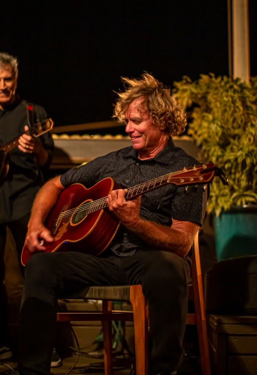 Shawn and Barney playing live at an evening show.